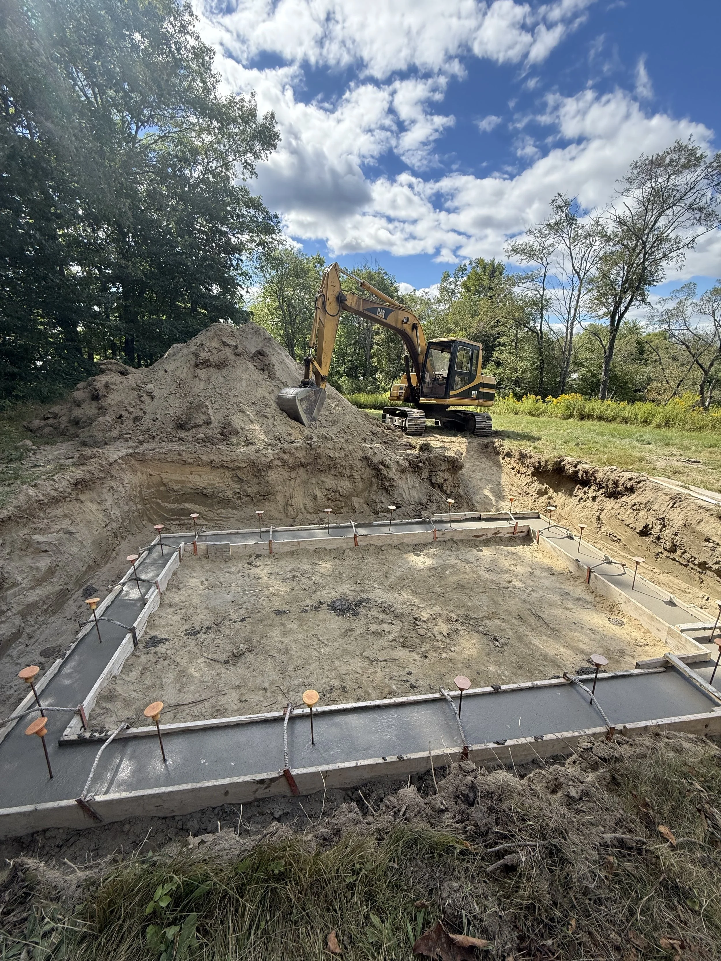 Excavator foundation concrete footing and forms 