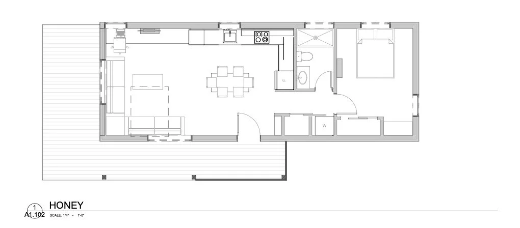 Floor plan of a plum prefab HONEY, a one-bedroom cabin with a living room, kitchen, bedroom, and bathroom, including a deck outside.