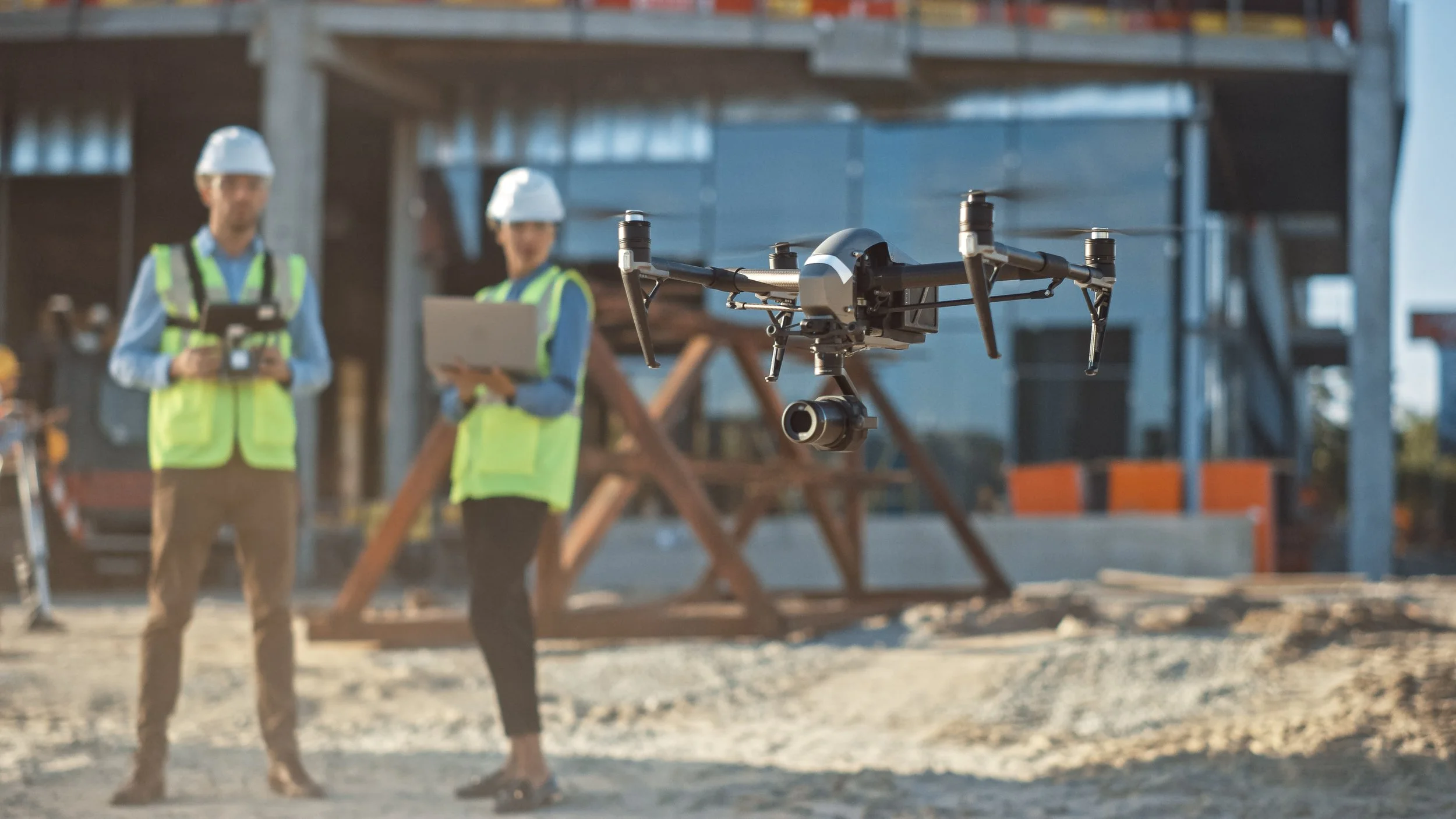 Commercial drone performing an inspection at a construction site.