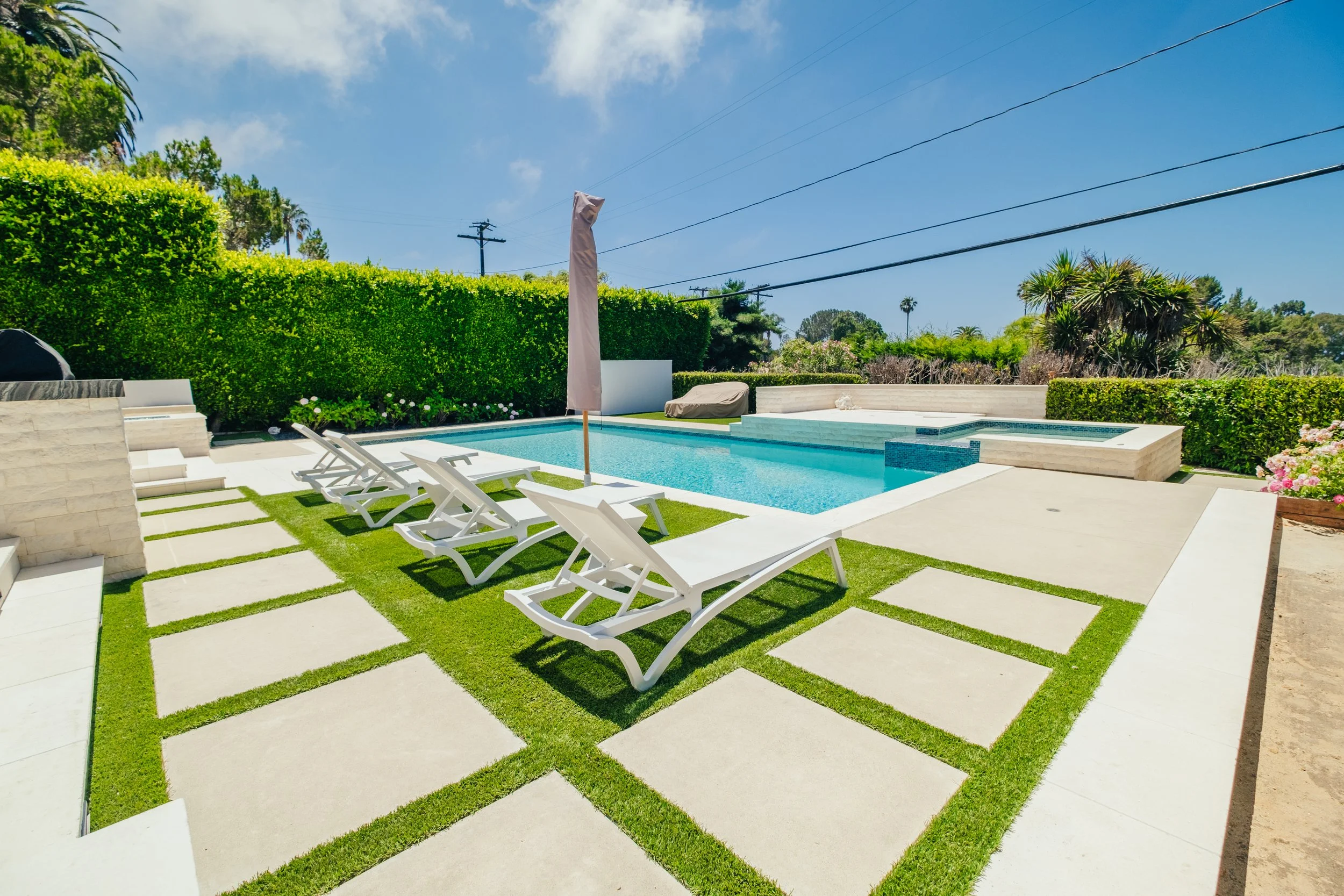 Custom backyard pool, patio and hardscape by Rosewood Landscape in Rancho Palos Verdes, California