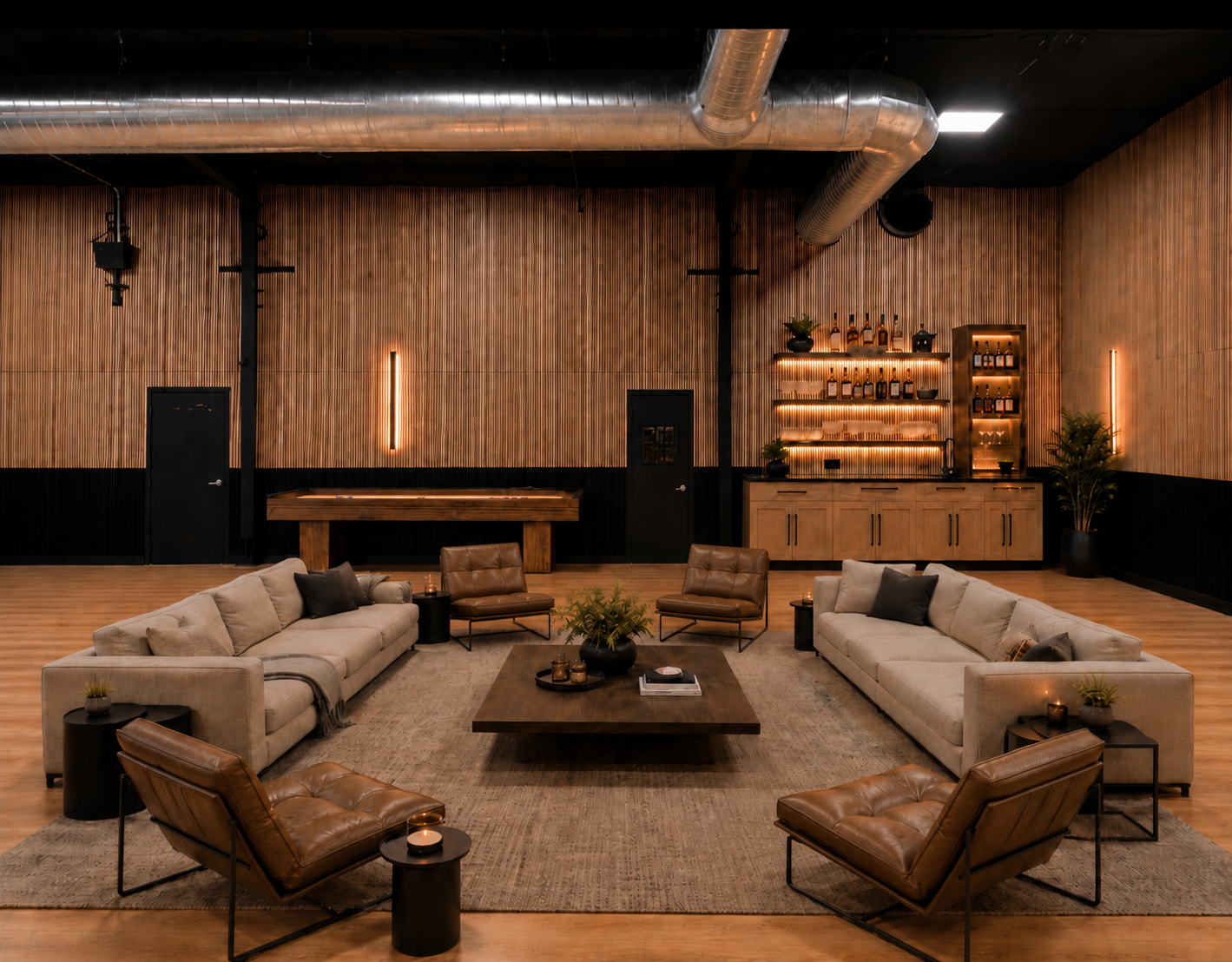 Modern lounge with beige sofas, leather chairs, a wooden coffee table, potted plants, and a bar area with illuminated shelves and bottles on back wall.