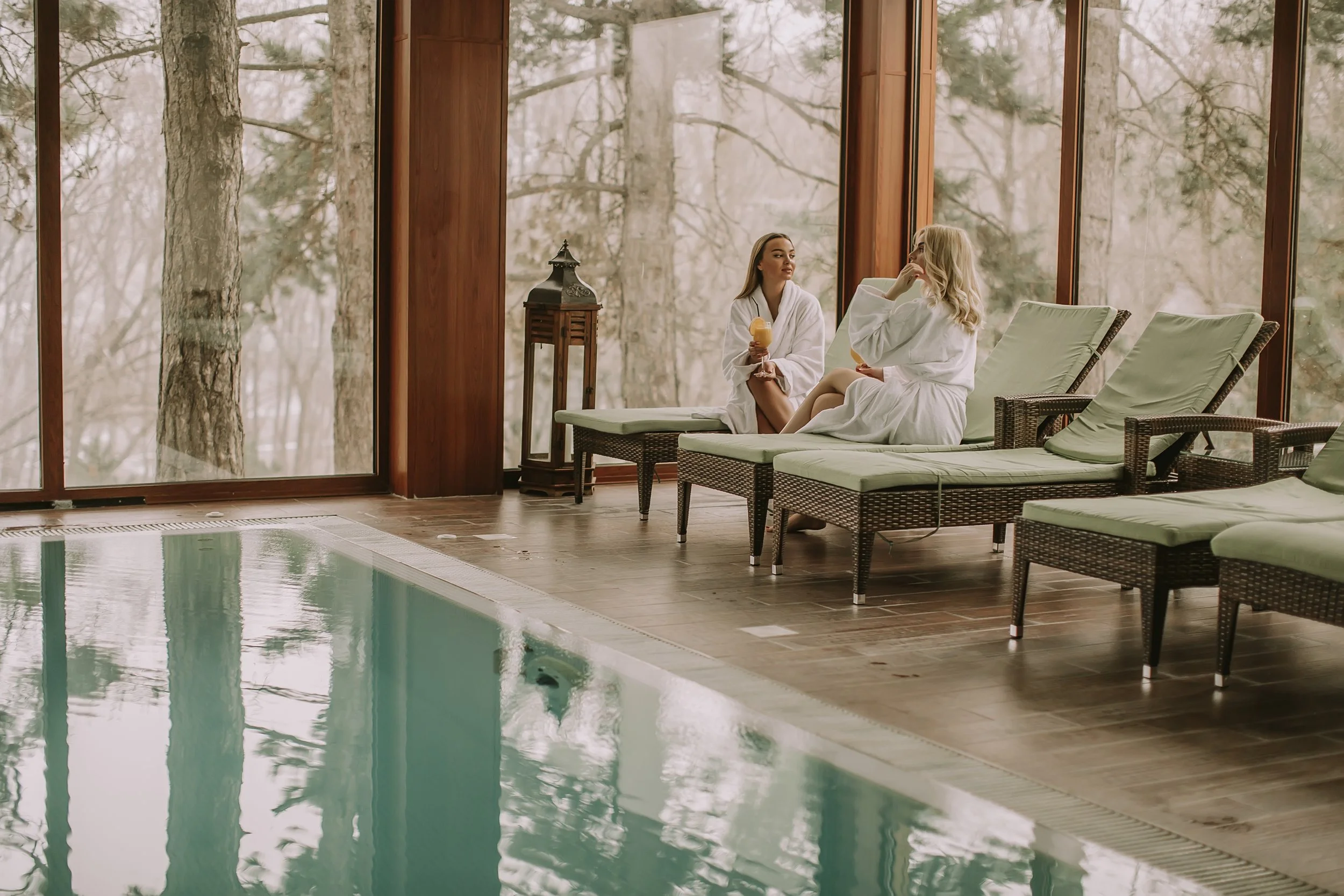women-relaxing-by-indoor-pool-at-luxurious-spa-2026-09-22-03-04-11-utc.jpg