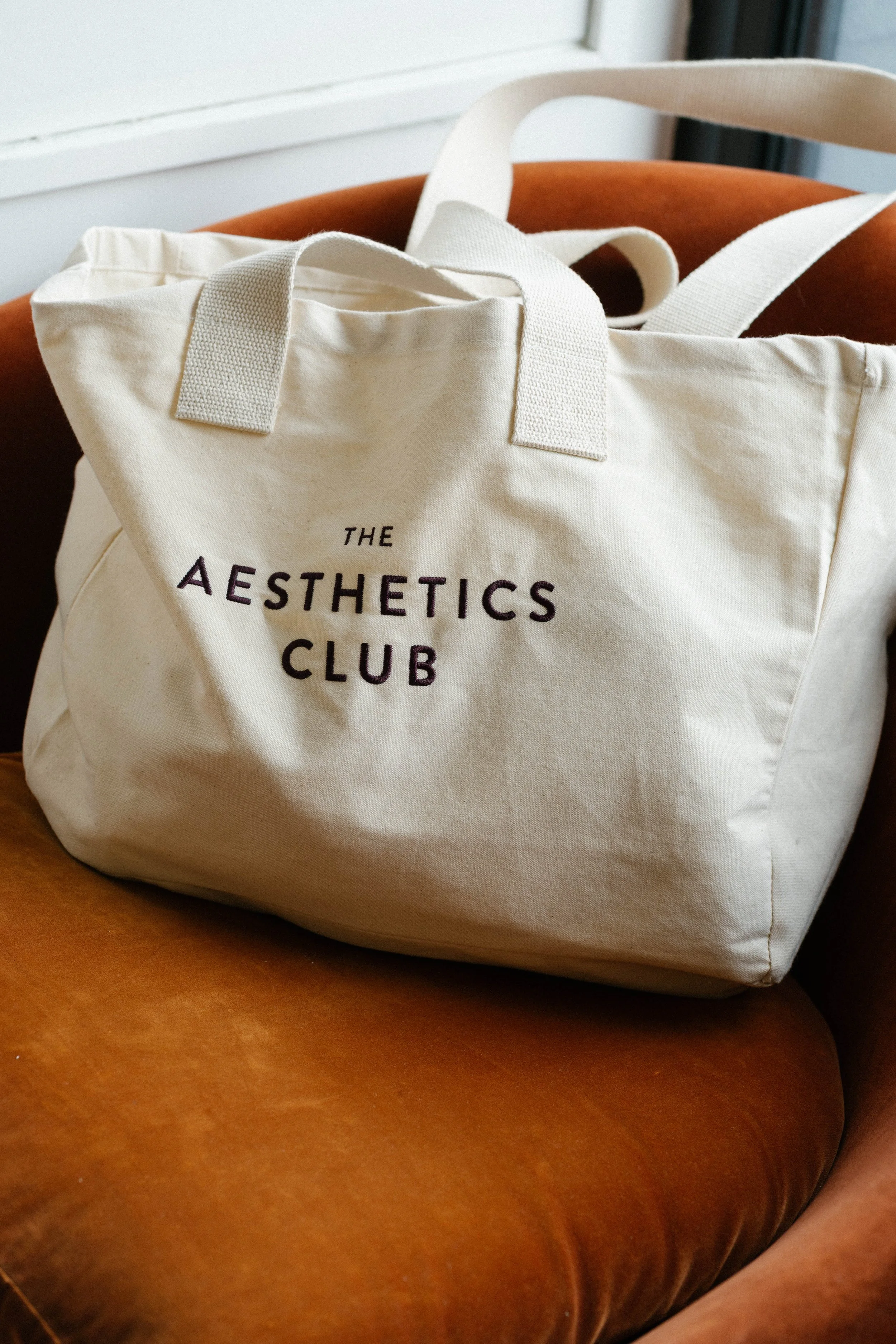 The Aesthetics Club canvas tote in the clinic
