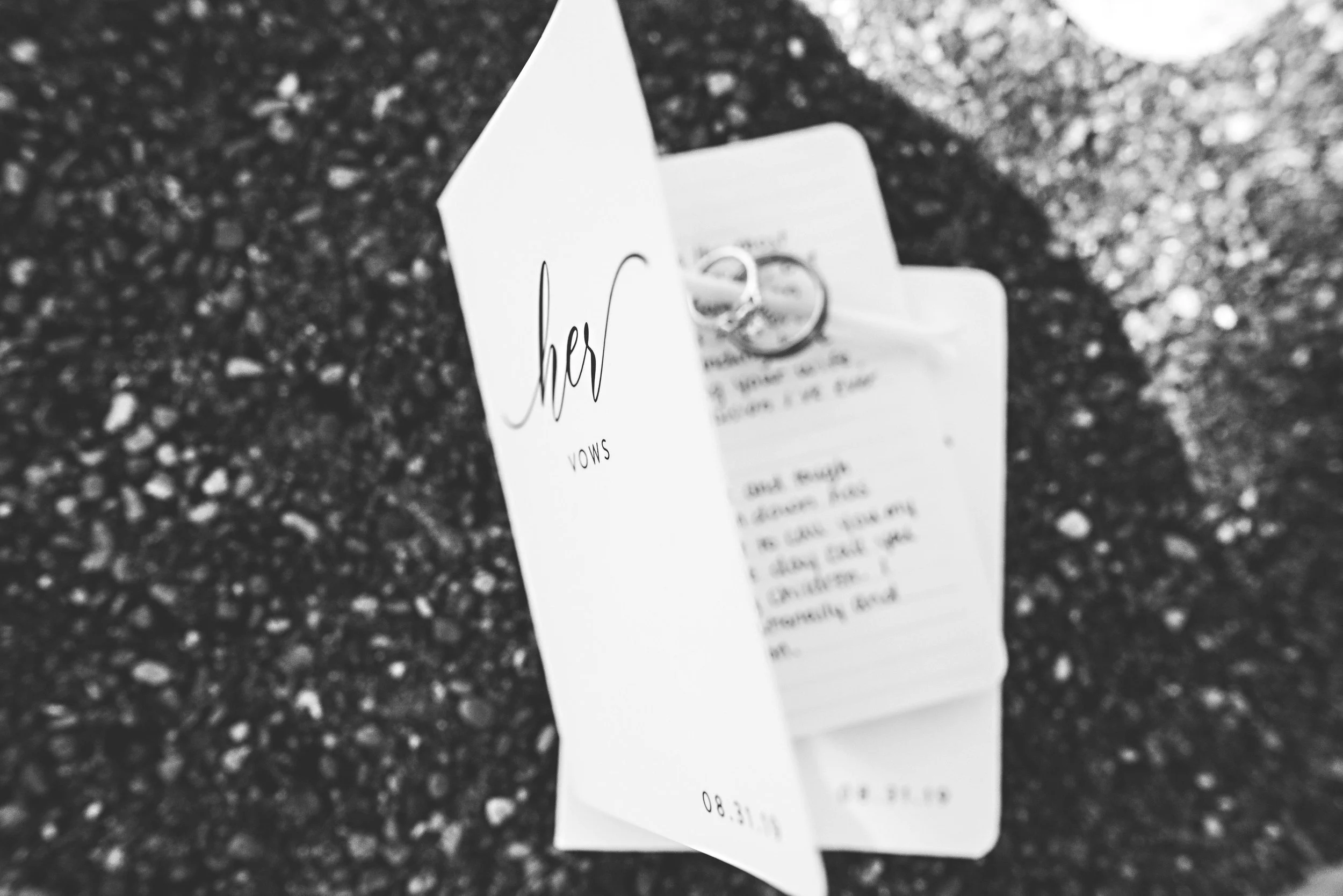 An invitation with some handwriting visible, along with a set of keys attached to the receipt.