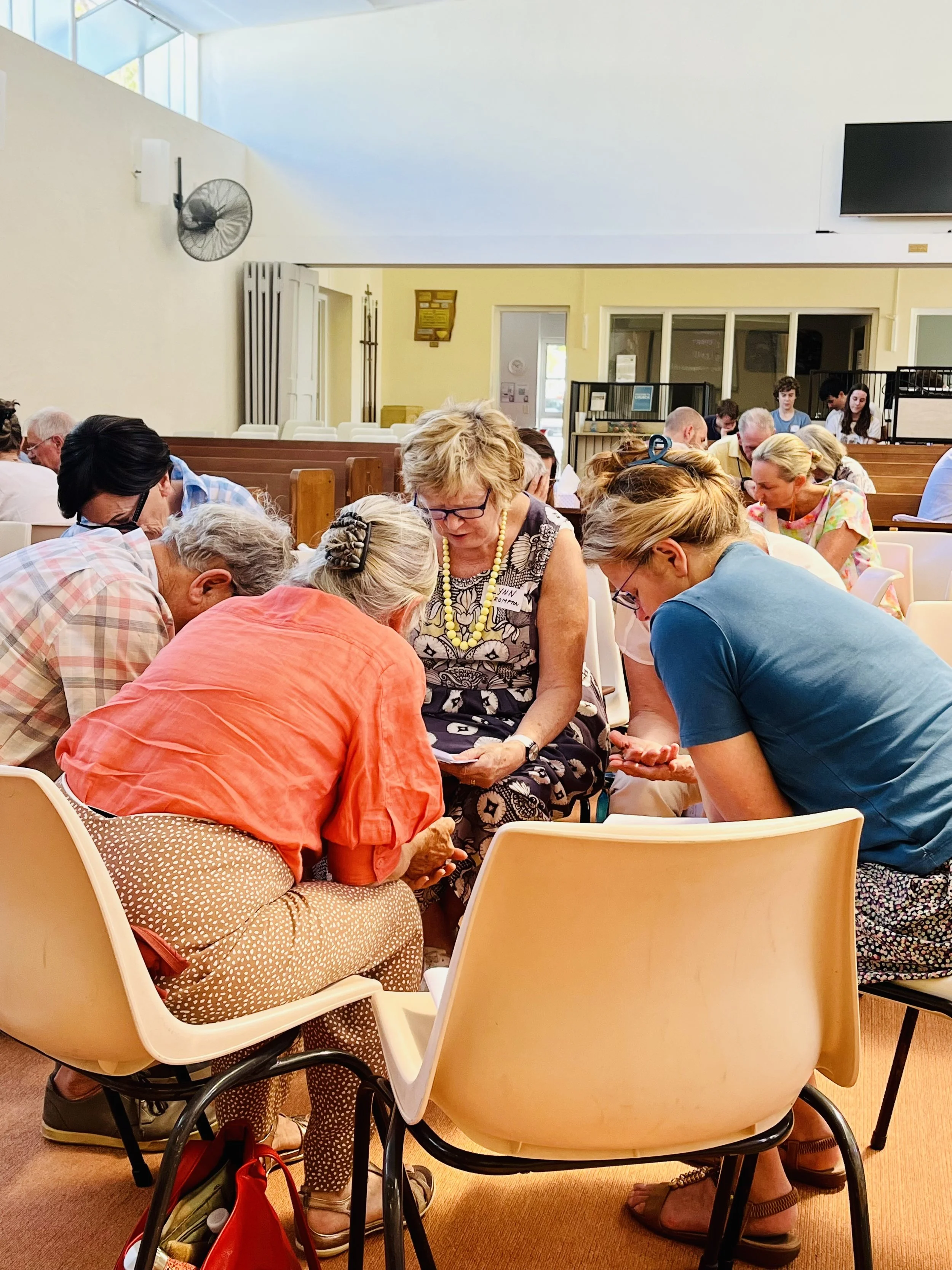 People praying together at St Philip’s in March 2023.