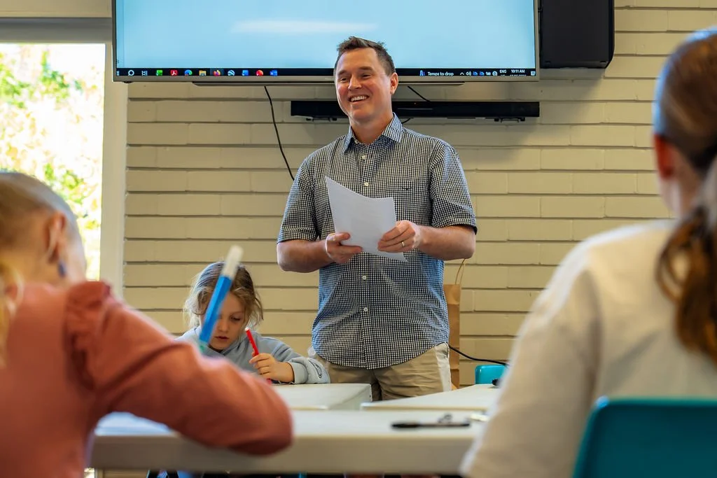 A leader teaching a group at KidsChurch.