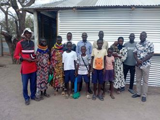 Children and community leaders gathered in Kalobeyei.