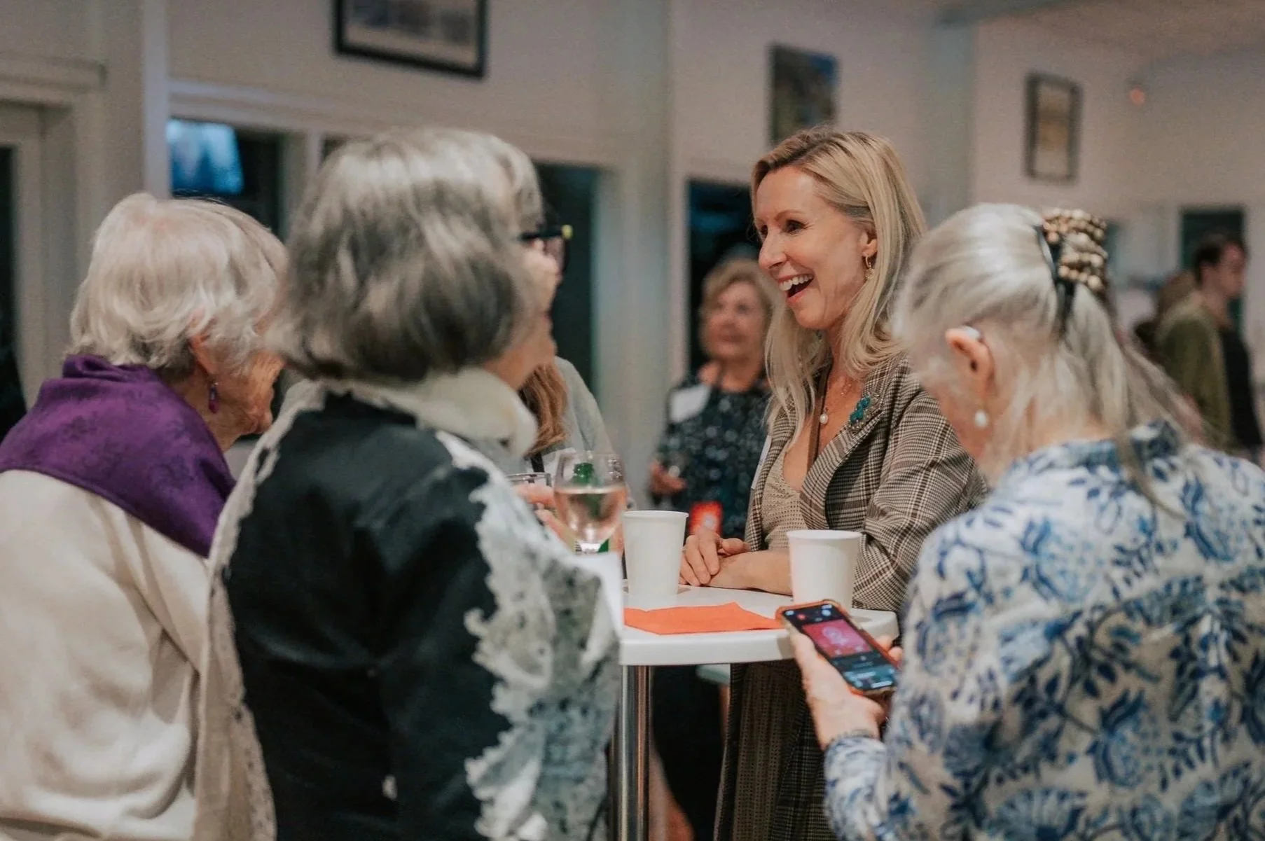 People meeting and sharing food at an Alpha gathering.