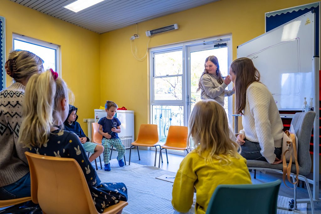 A leader and children taking part in KidsChurch