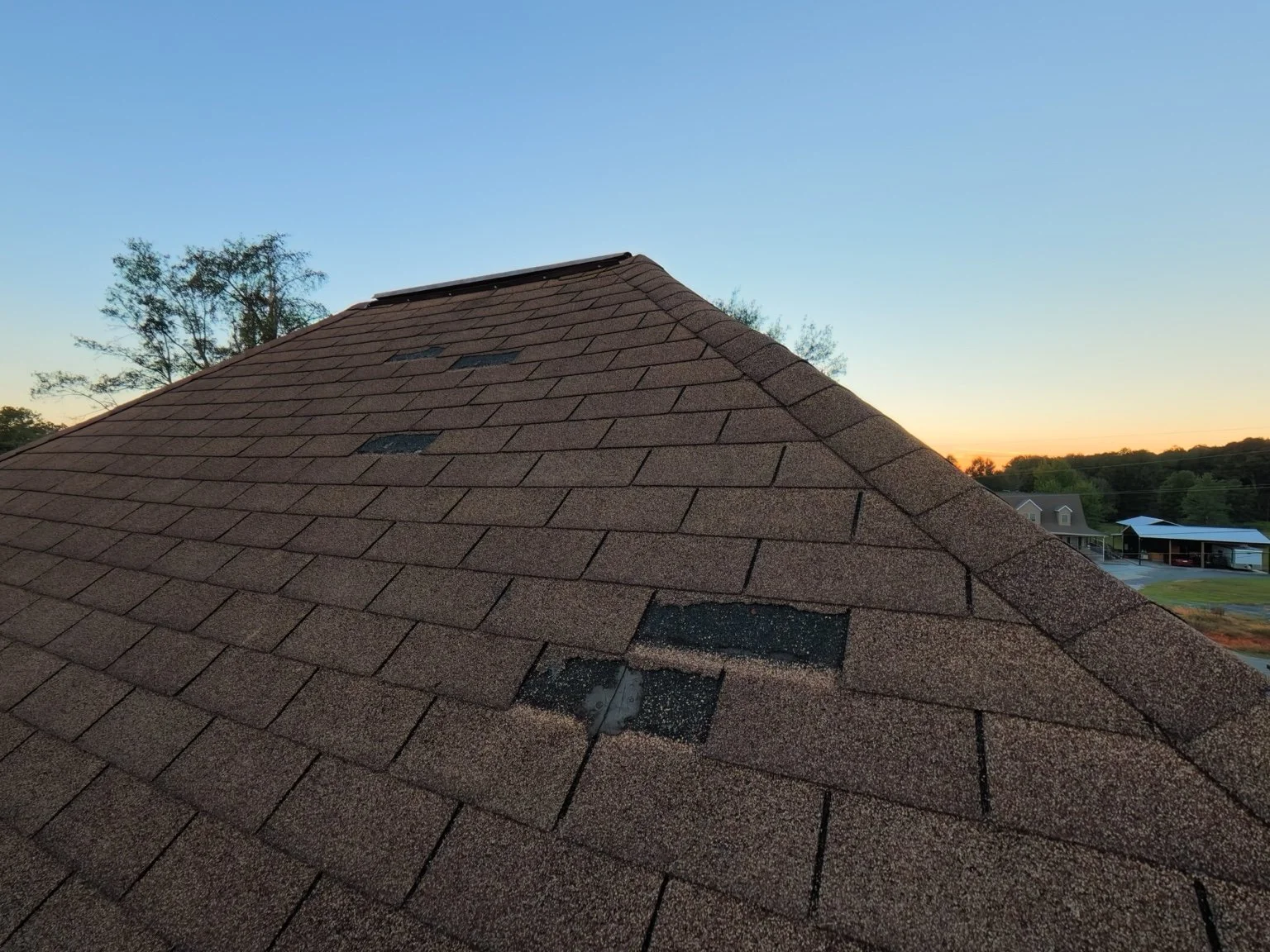 Missing shingles deserve a closer look. Gaps in roof coverage can leave the layers underneath exposed.