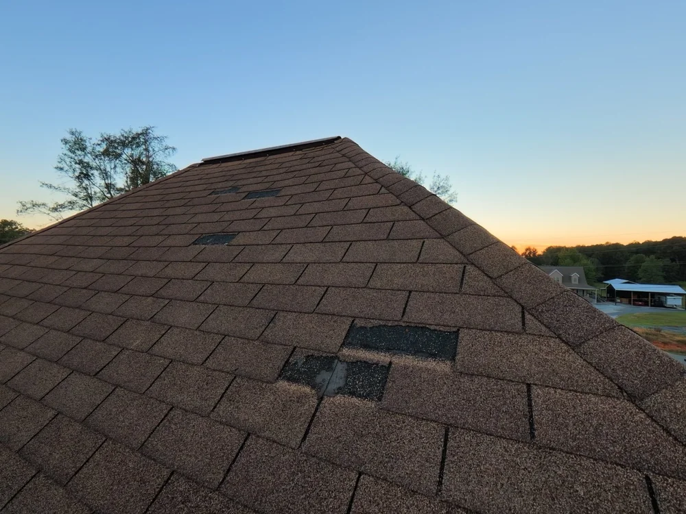Missing shingles deserve a closer look. Gaps in roof coverage can leave the layers underneath exposed.