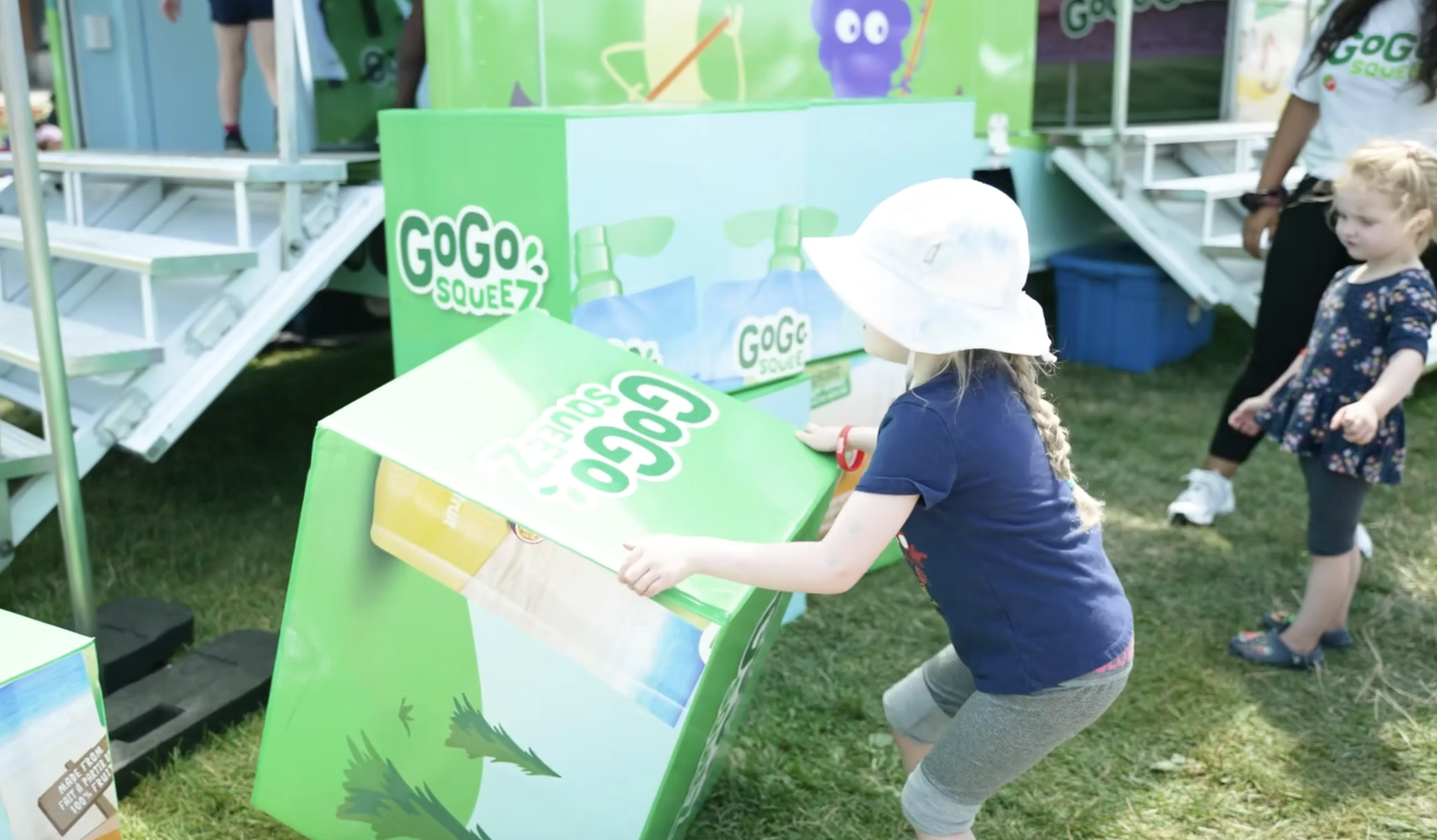 GoGo Squeez Kid playing with branded blocks.png