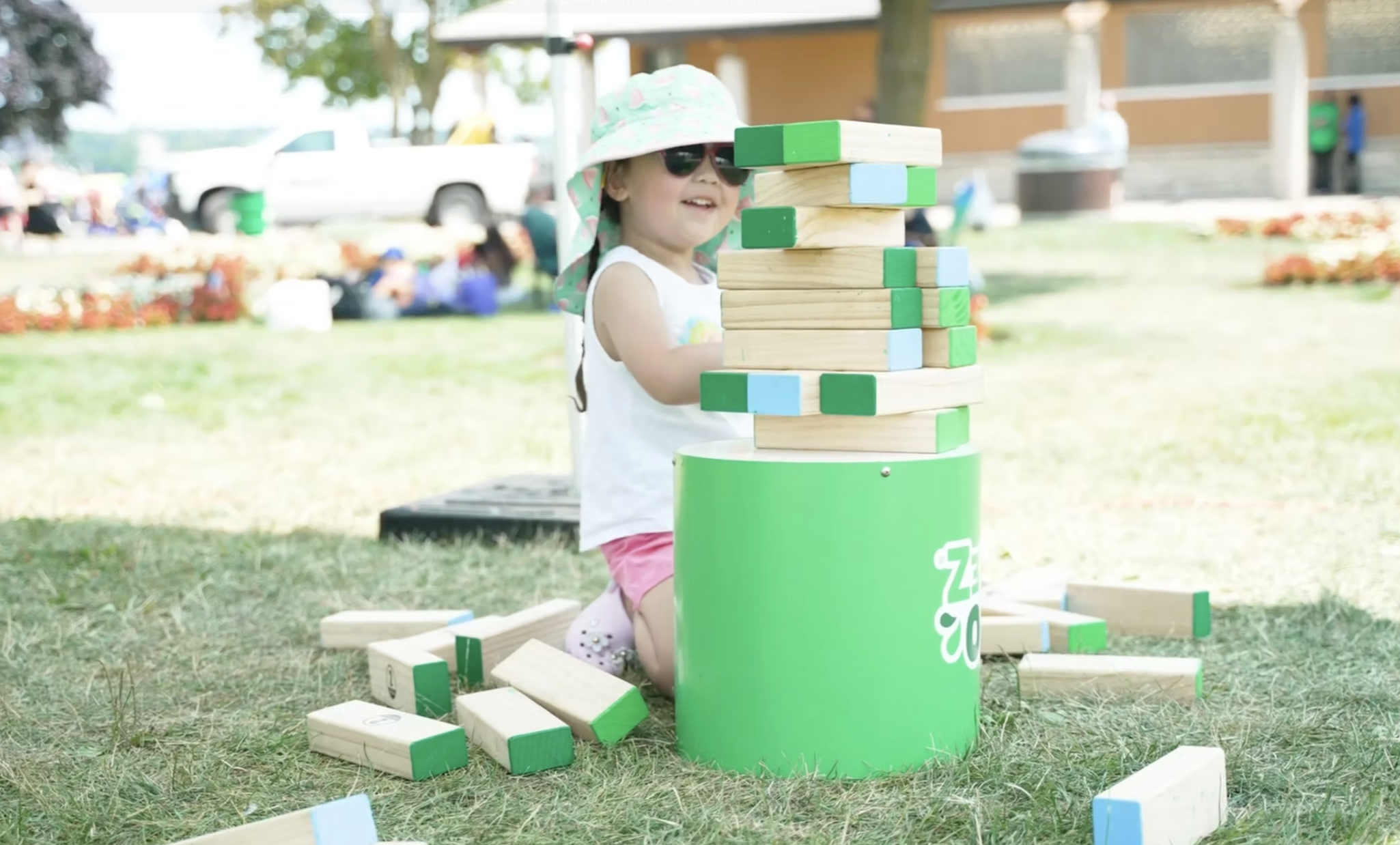 GoGo Squeez Child plays with Branded blocks.png