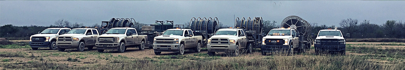 Qwik Pipe service trucks and lay flat hose reel trailers ready for a water transfer job