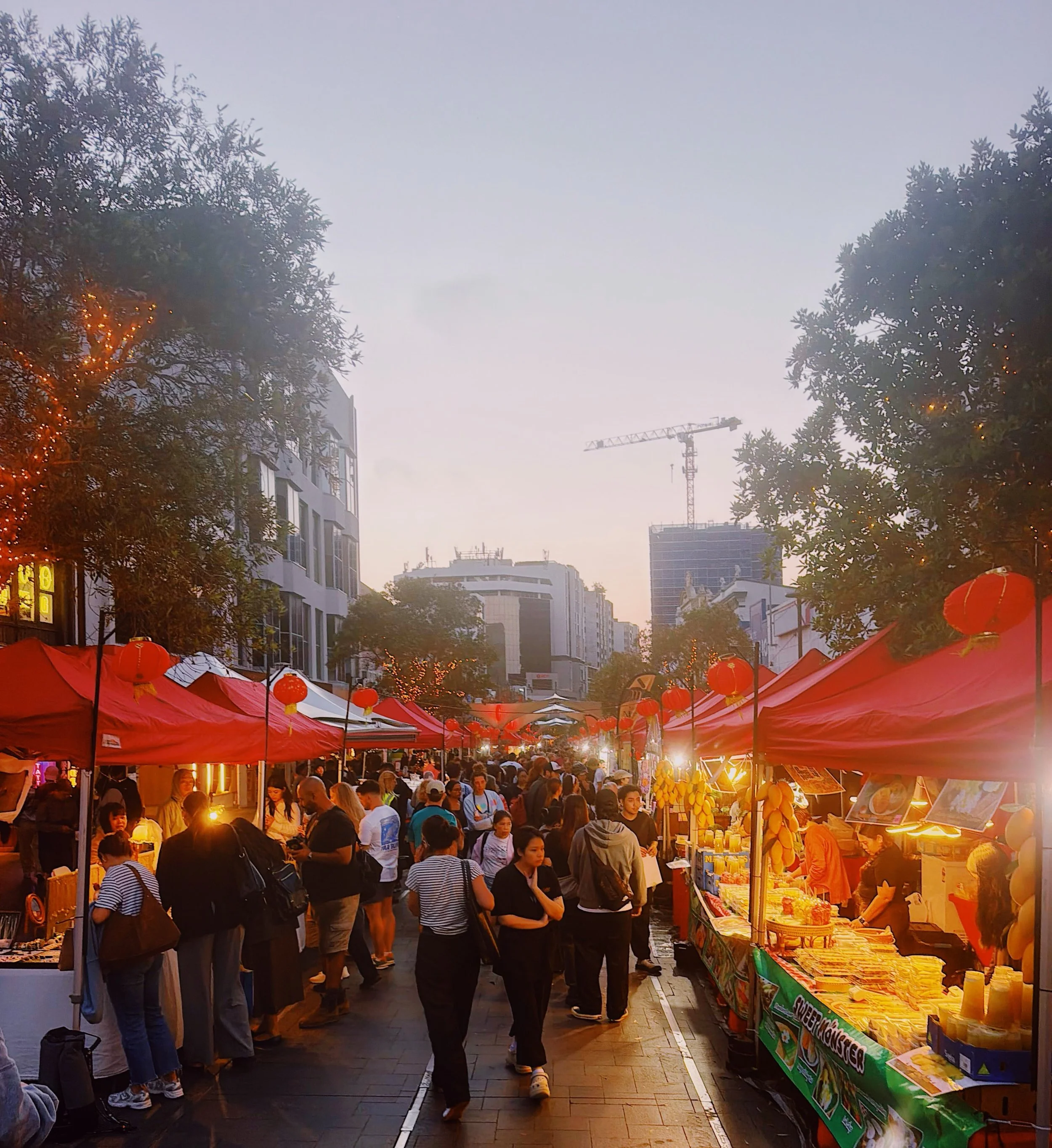 Twilight Markets crowd at dusk on Oxford Street Mall, Bondi Junction