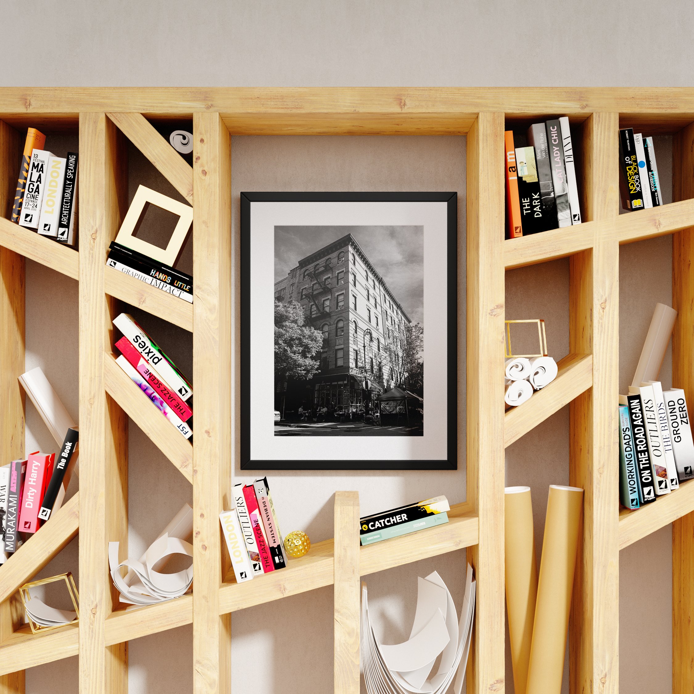 Black and white New York architecture print in a black frame, styled on a modern geometric wooden bookshelf.