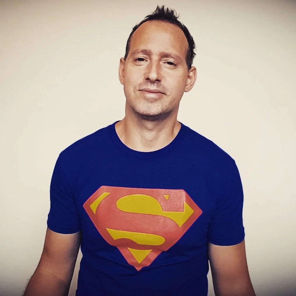 Chris Zanetti wearing a Superman logo T-shirt, confident that he will become a demigod.