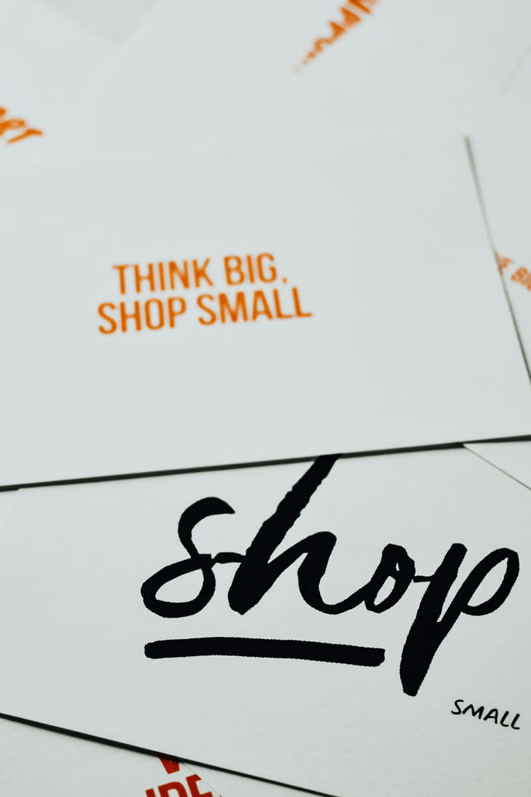 Printed promotional cards encouraging people to shop local