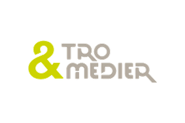 Logo av to og medie med grønne og grå bokstaver