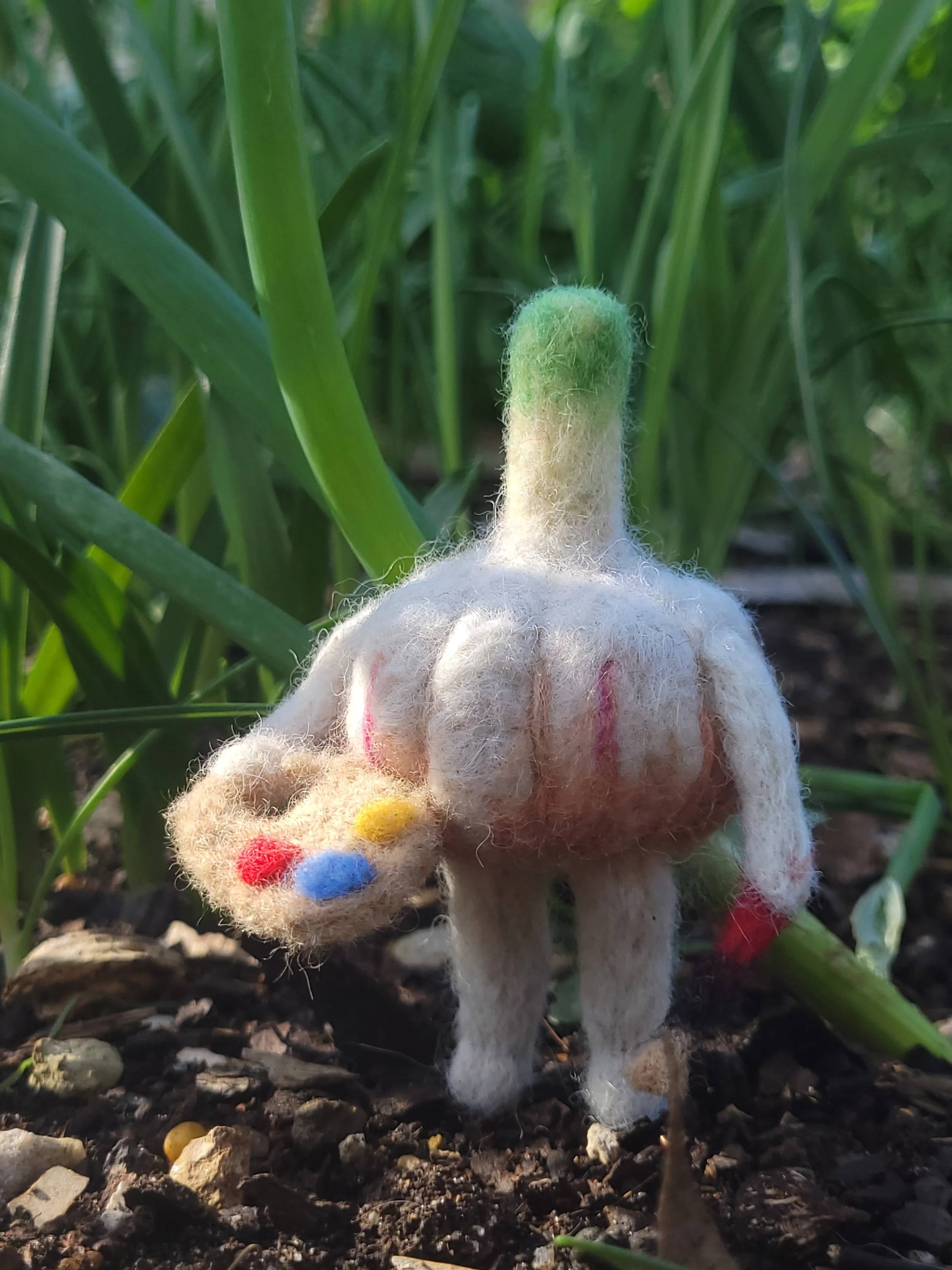 An artistic garlic with a brush and palatte