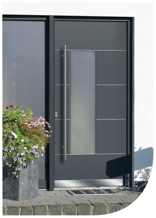 Modern gray front door with metal handle, window panels, and a potted flowering plant outside on the left.