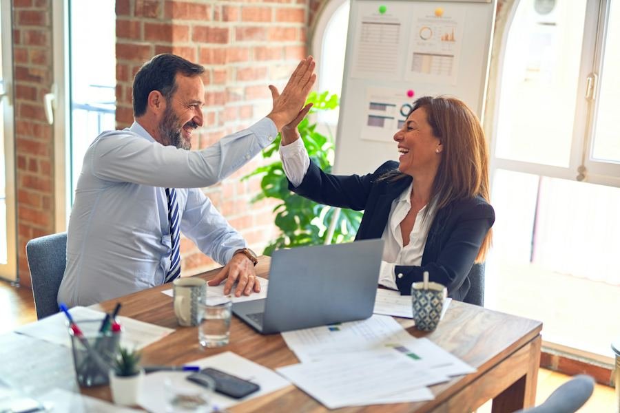 Business owner reviewing monthly financial reports with her bookkeeper