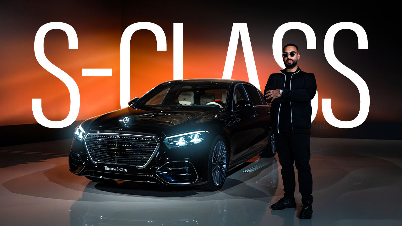 Mercedes-Benz S-Class
    EMKWAN beside a black Mercedes-Benz S-Class during an automotive launch event.