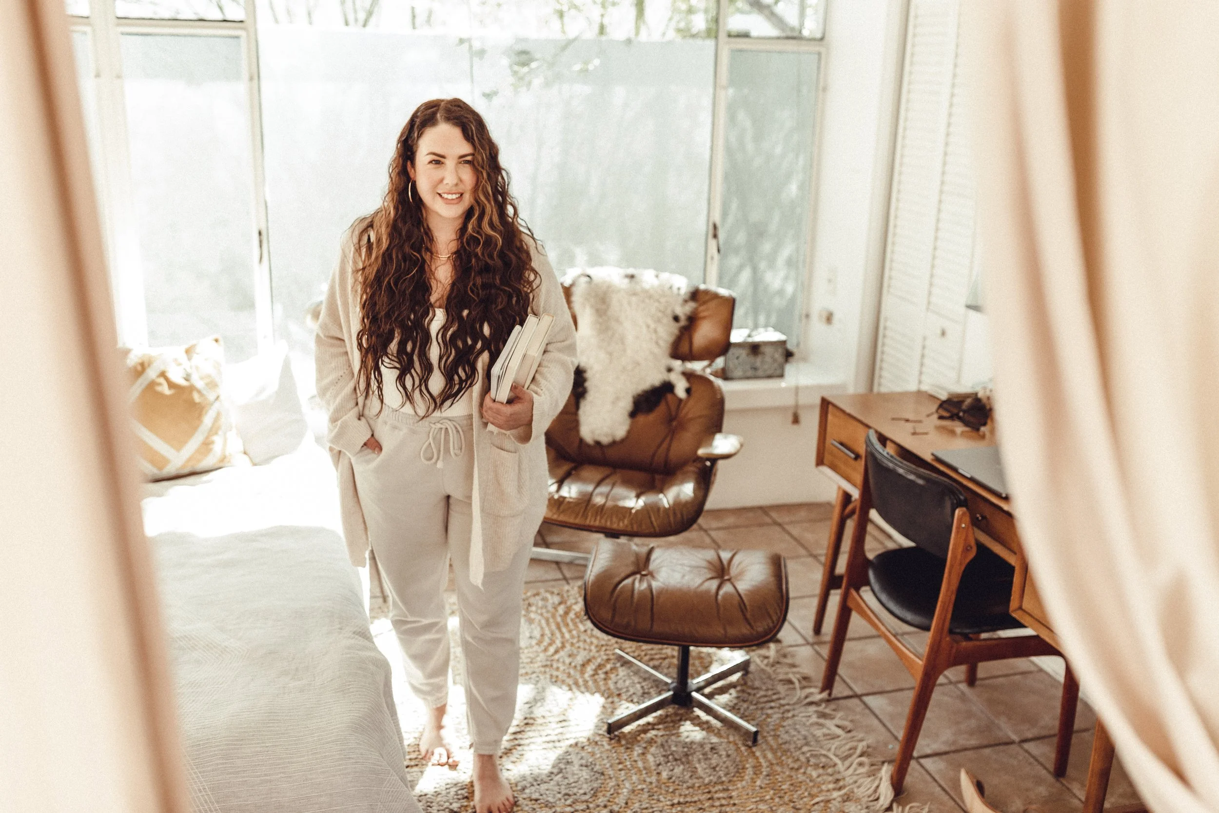 Melissa Jaramillo, owner of Aloe Studio wearing long 24 inch extensions in a chocolate color and styled wavy for a lifestyle photoshoot. Aloe Studio does lifestyle photoshoots.
