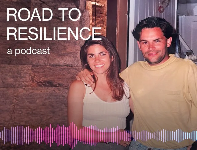 A podcast cover image featuring a woman and man smiling together, standing in a rustic indoor setting with wooden walls. The title reads "Road to Resilience" with a subtitle "a podcast" and a colorful audio waveform at the bottom.