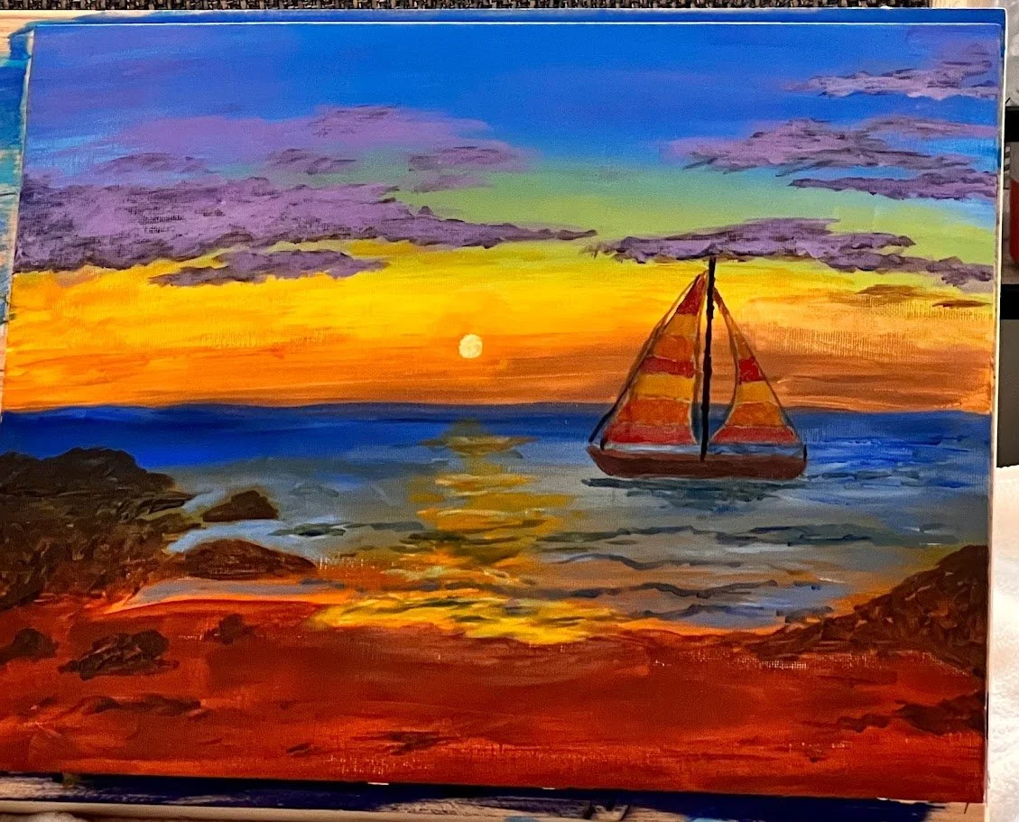 beach with sailboat at sunset.jpg