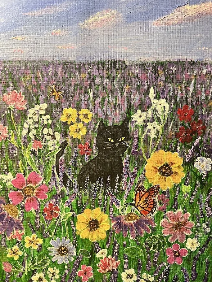 cat in a field of flowers.jpg
