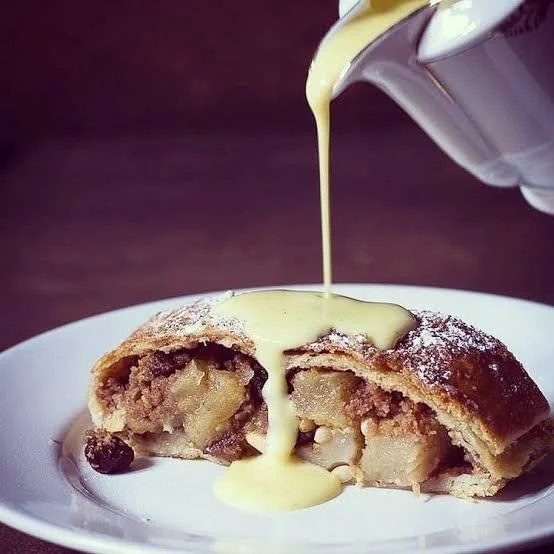 strudel with custard pouring on top.jpeg