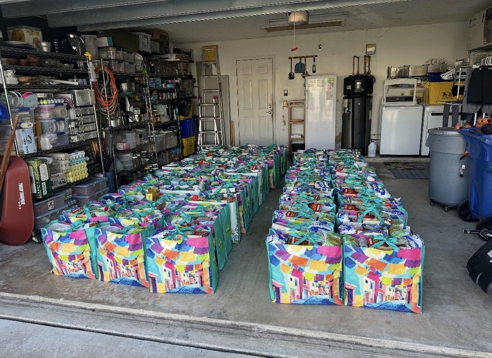 Volunteers assembling food bags