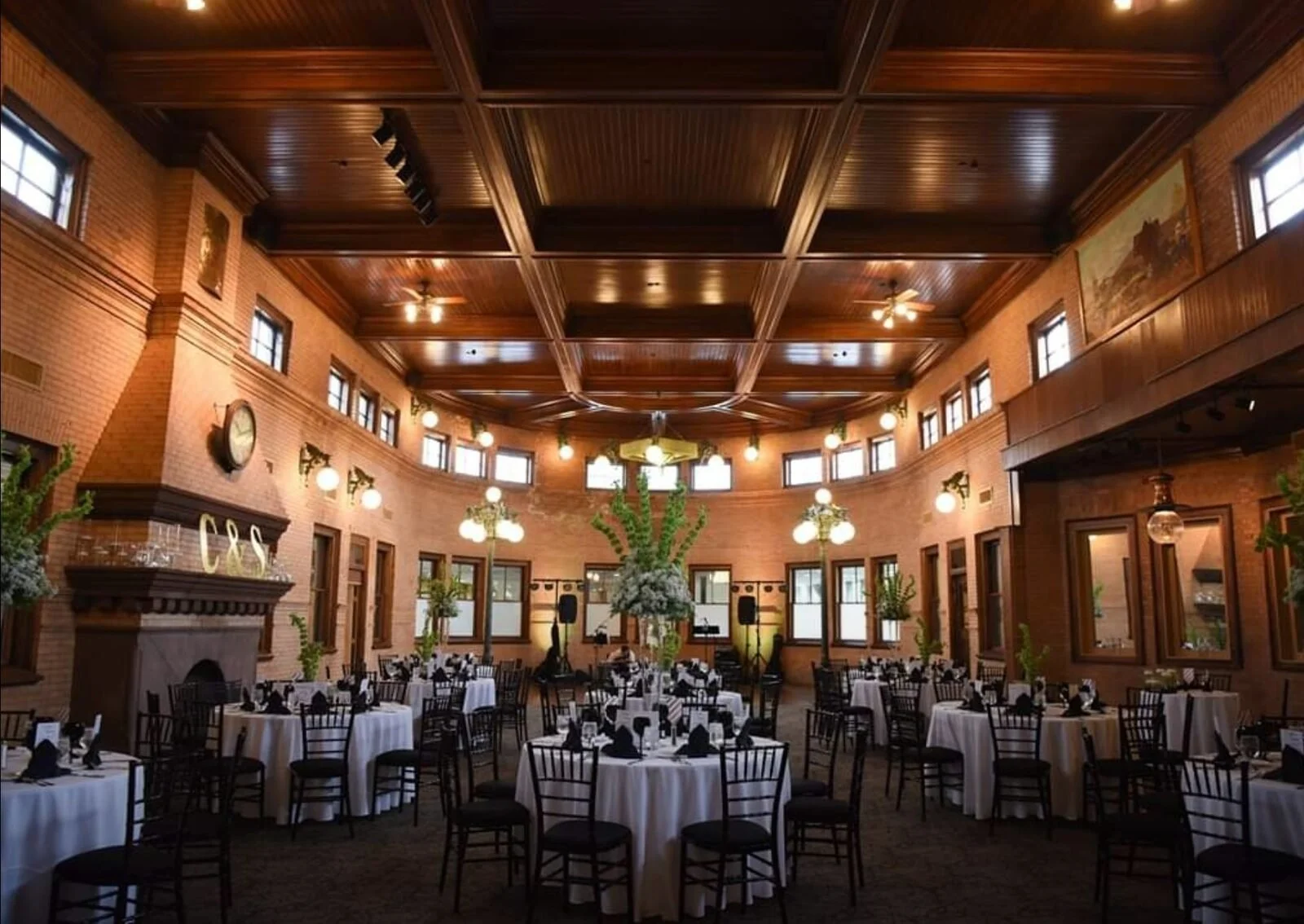 The Roosevelt Grand Ballroom at Union Station Banquets in Northampton, MA, set with round tables under a coffered wood ceiling