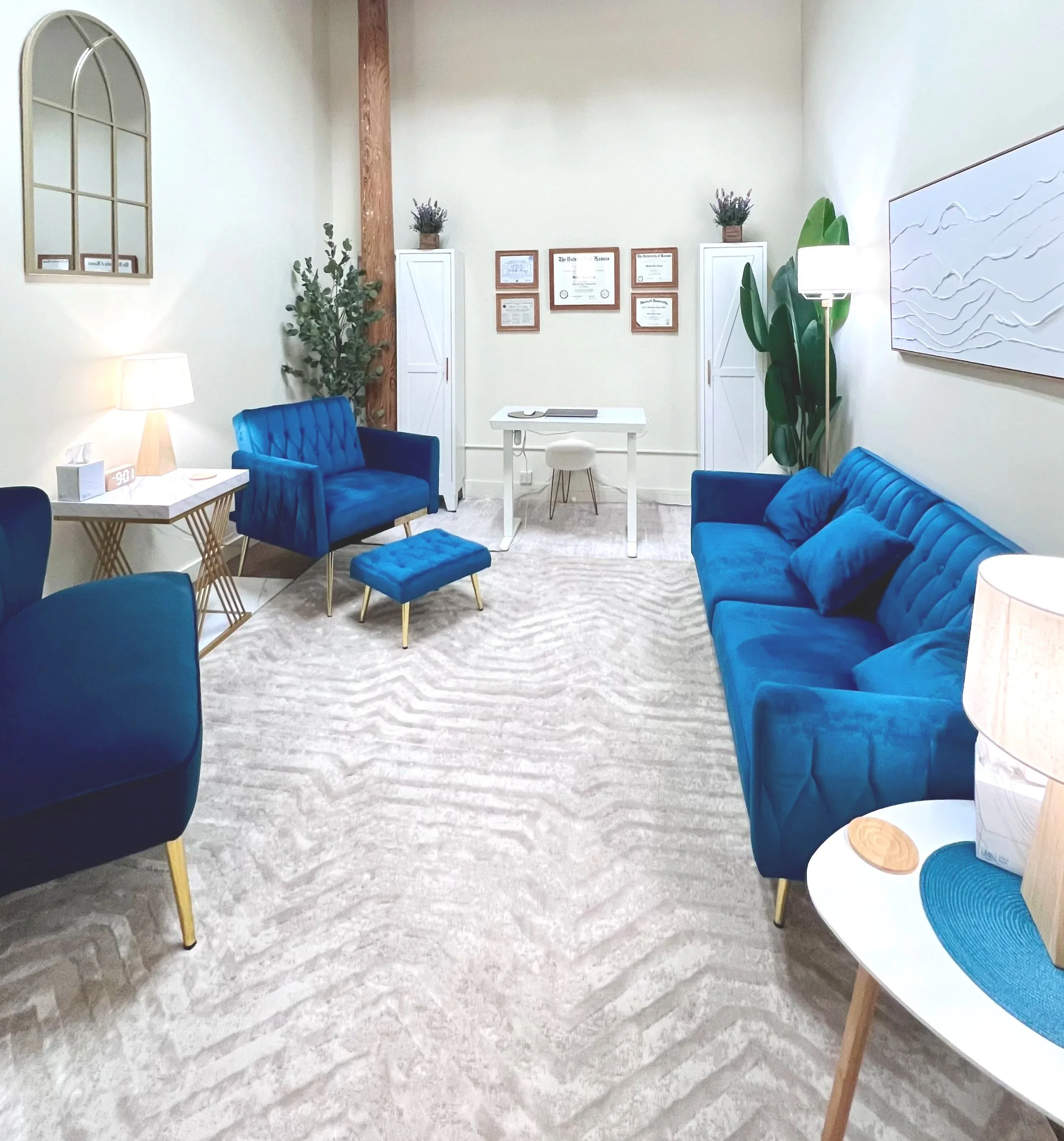 Kanga Counseling’s office in Brunswick, Maine, with blue seating, plants, and natural light.