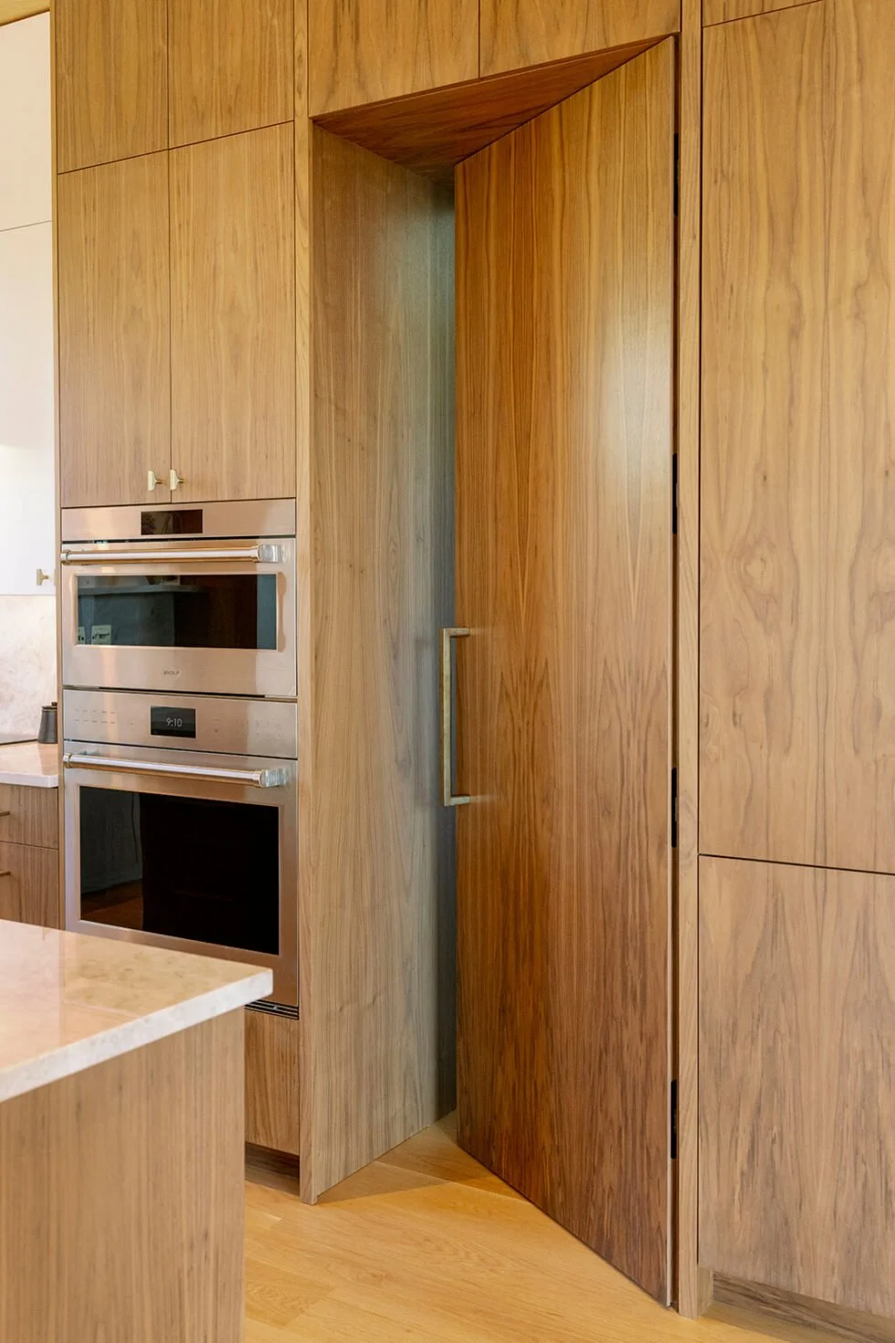 ARK-CIRCA-Walnut-Cabinetry-Integrated-Door-Detail.jpeg