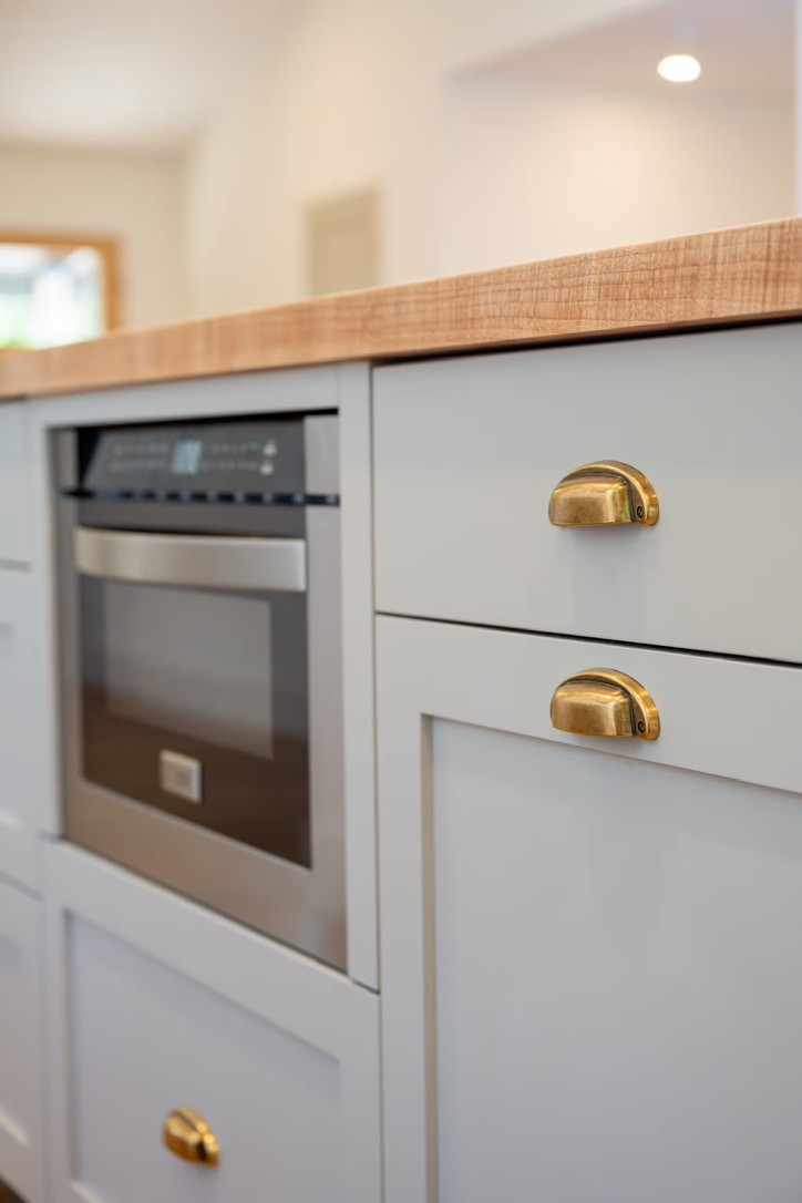 ARK-COTSWOLD-English-Modern-Painted-Kitchen-Cabinetry-Brass-Cup-Pulls.png