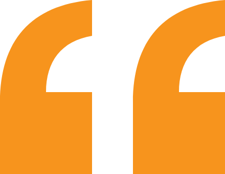 Close-up of orange quotation marks on a black background.