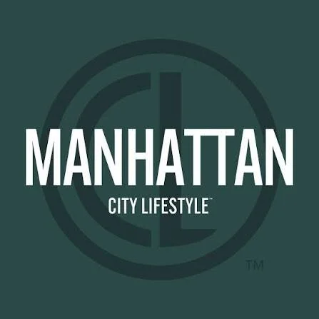 Manhattan City Lifestyle logo with a compass design in the background.