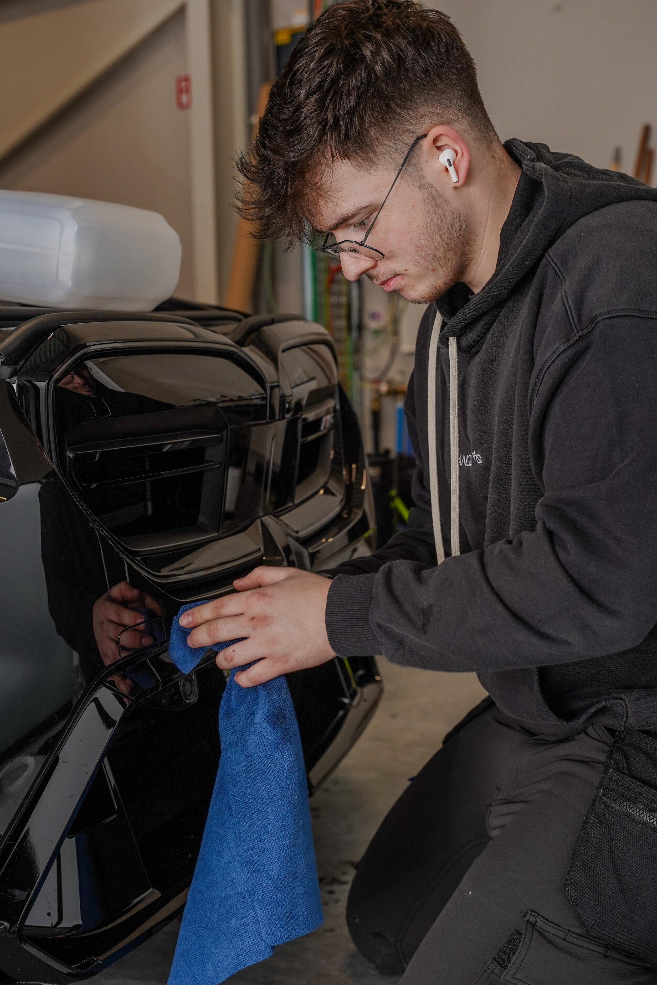 I'm the one preparing the car for the installation of the PPF to protect it from stone chips and scratches