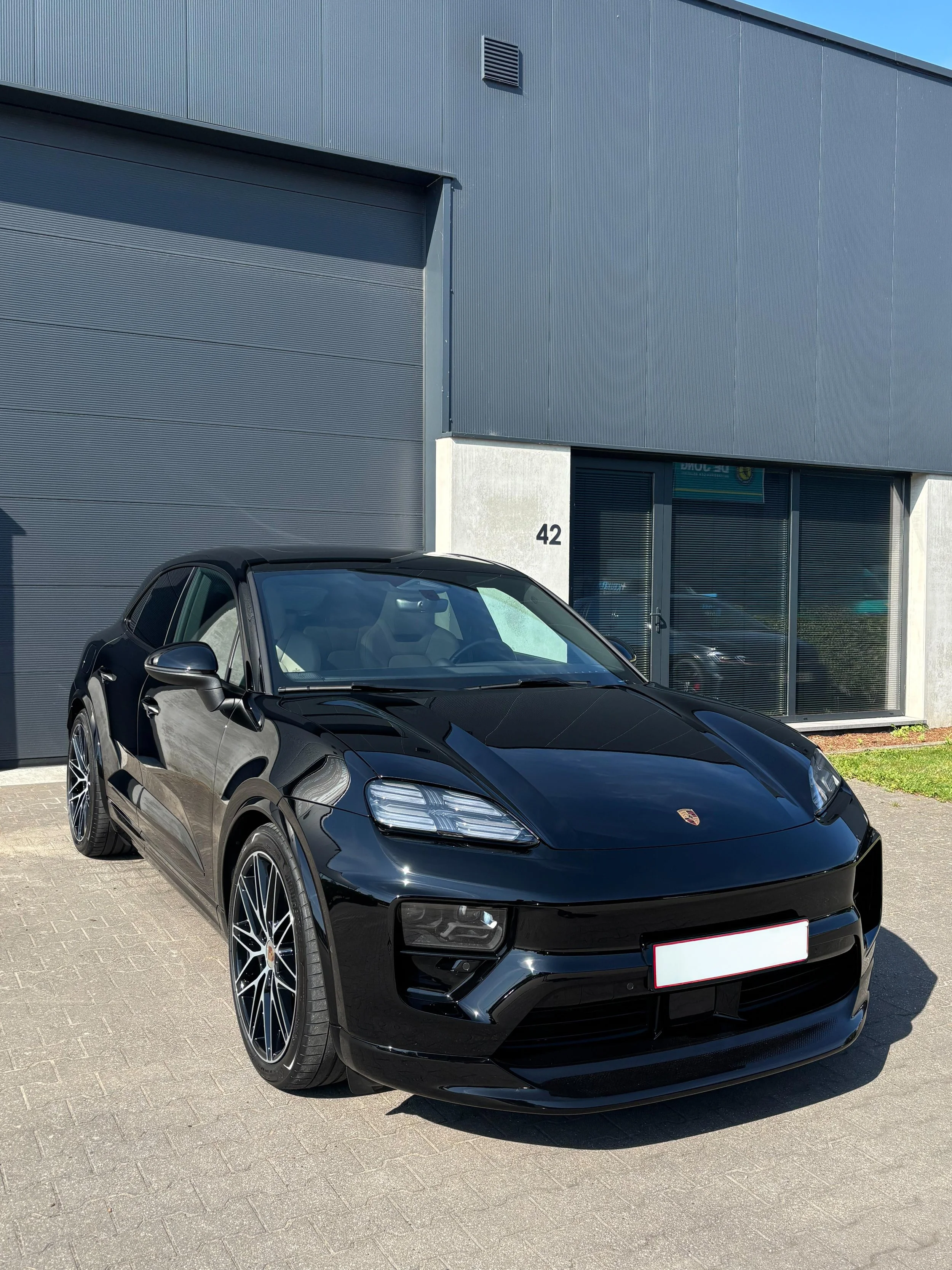 A Porsche treated with a ceramic coating and thoroughly polished in multiple steps to achieve maximum shine and minimize swirl marks and scratches, and protects