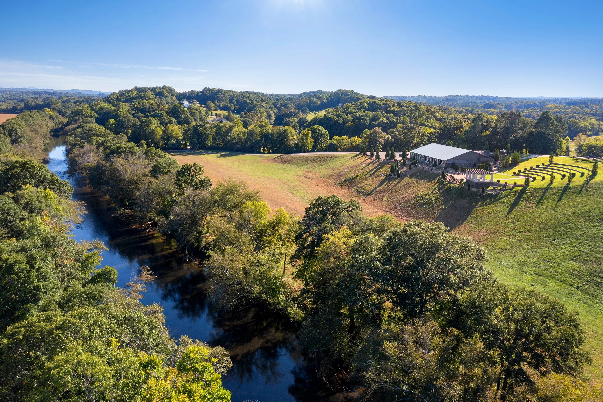 Aerial view of Ocoee River Estate showcasing private river frontage and scenic natural surroundings along the Ocoee River in Tennessee.