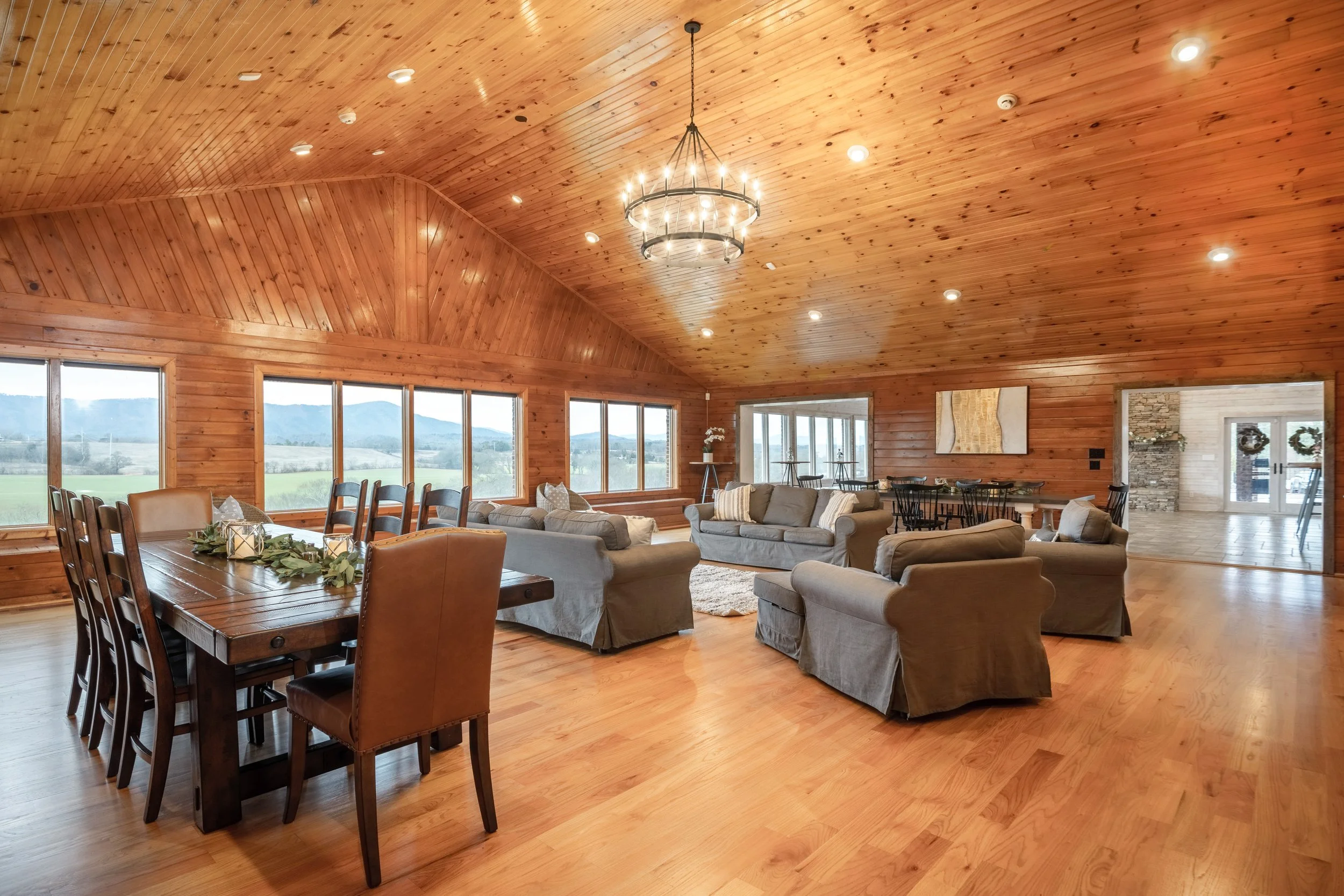 The expansive living room overlooking the Ocoee River with mountain views at the main residence at the Ocoee River Estate