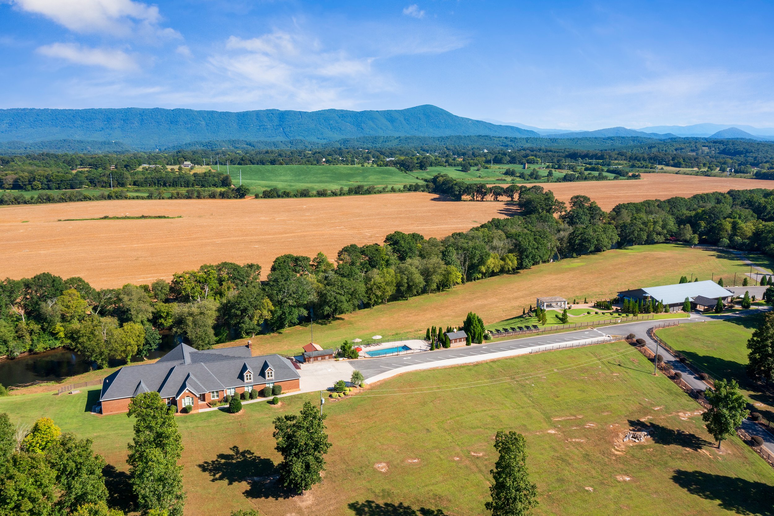 The main residence at the Ocoee River Estate in Benton Tennessee features a resort style pool and relaxation area