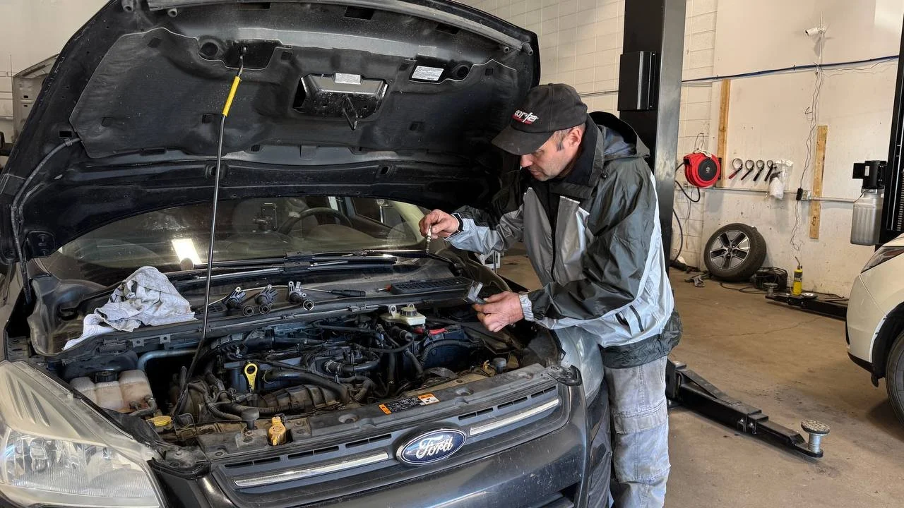 Mechanic checking an engine during diagnostics and repair