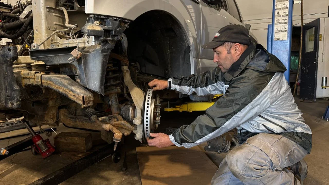 Mechanic inspecting a brake rotor