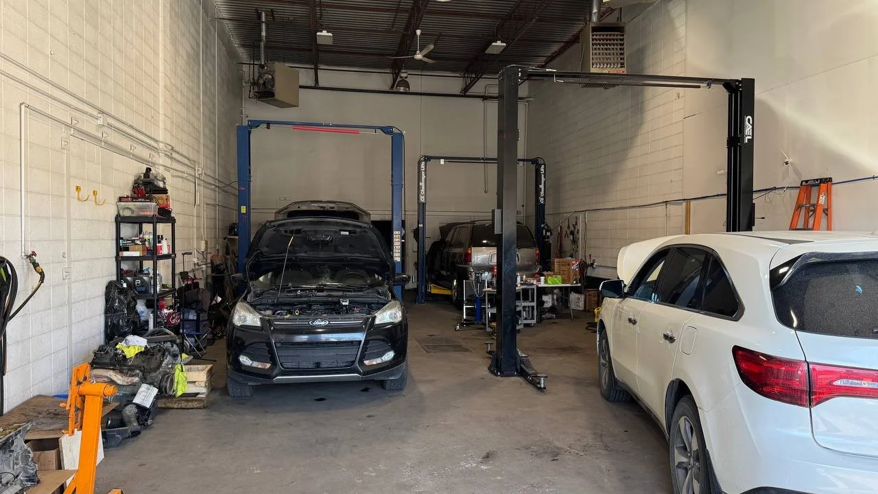 Interior of the Spectrum Truck Services workshop with vehicles and service bays