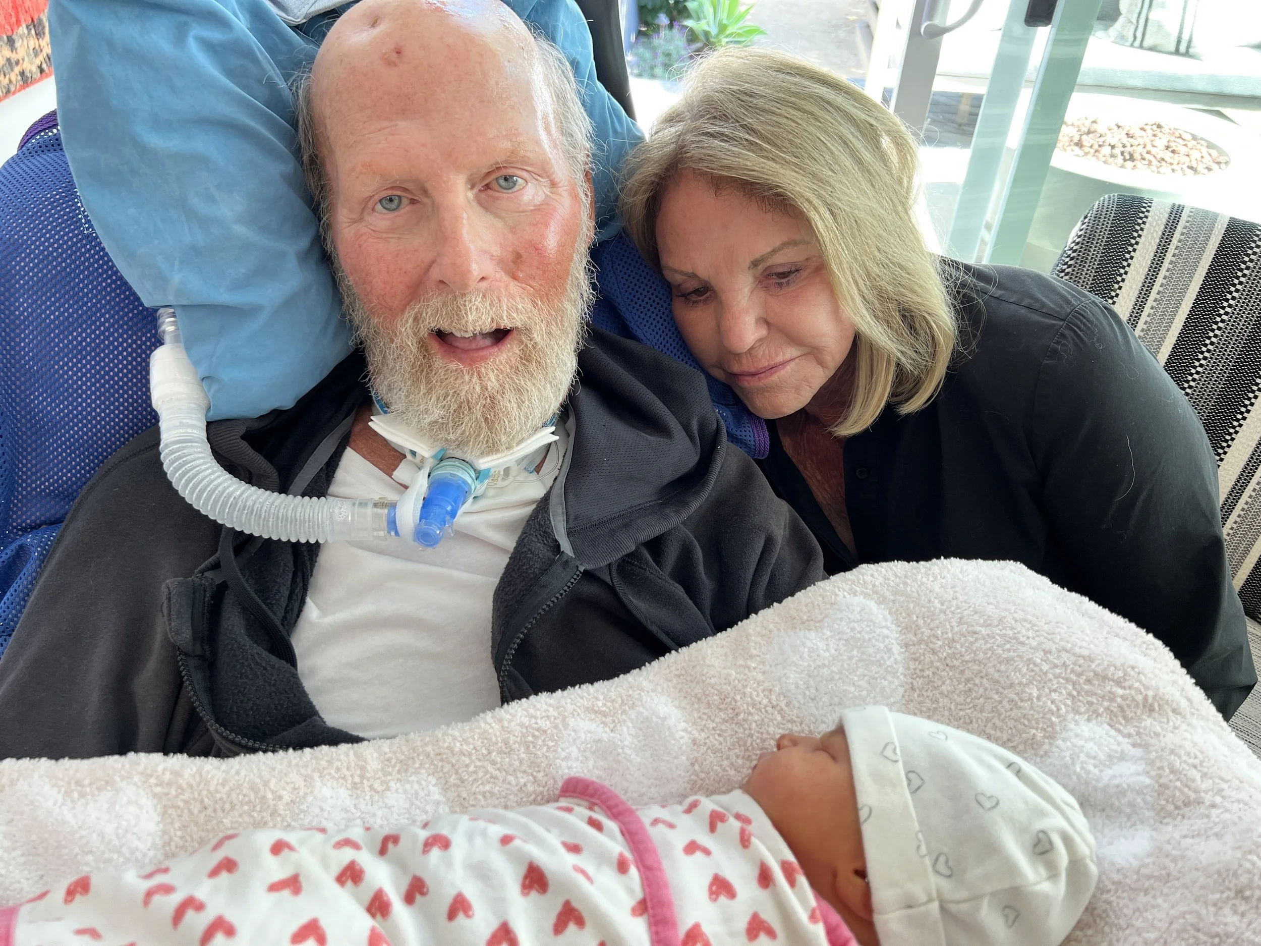 Meeting his granddaughter Deacon for the first time.jpeg