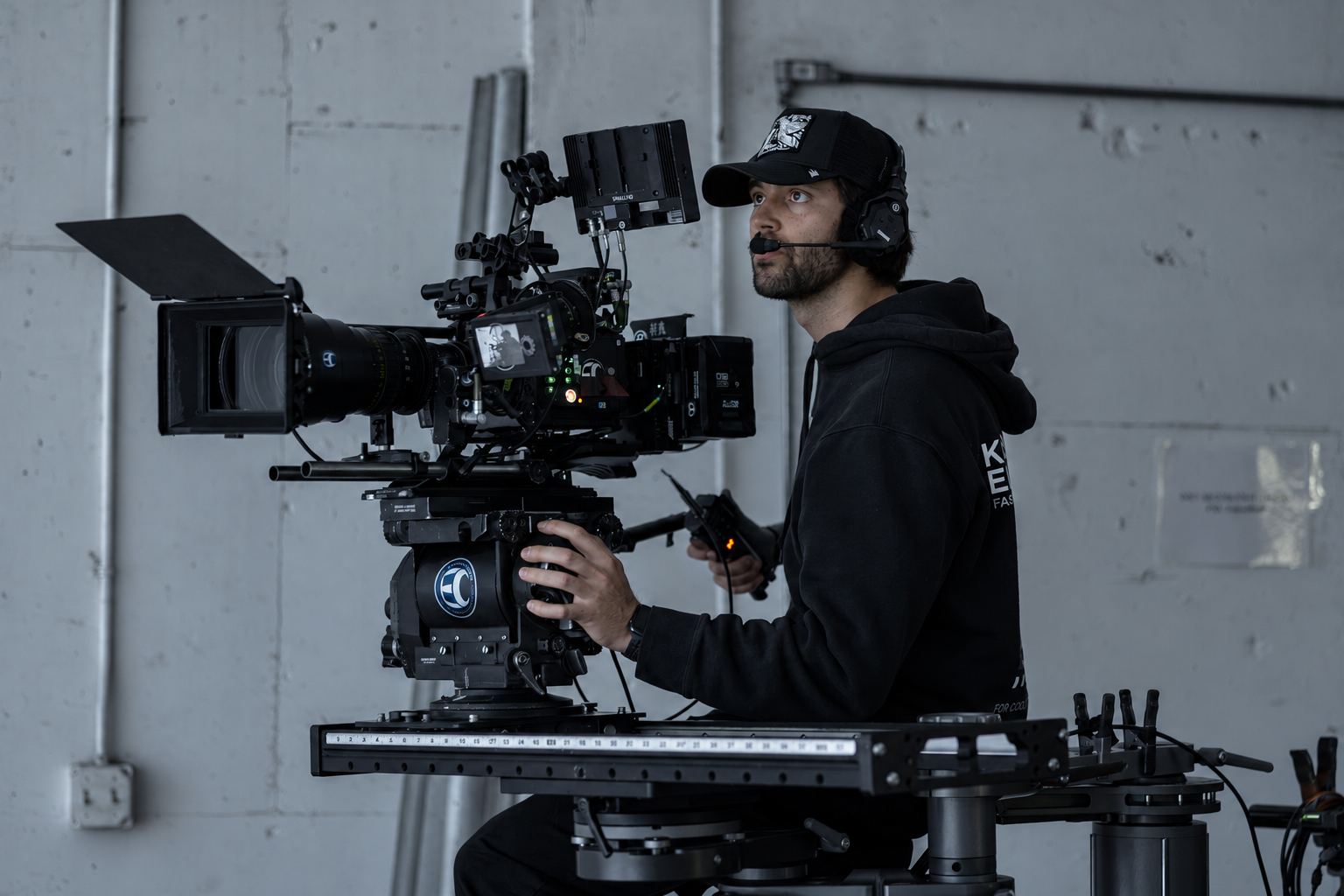 Toby Romero operating a cinema camera on set