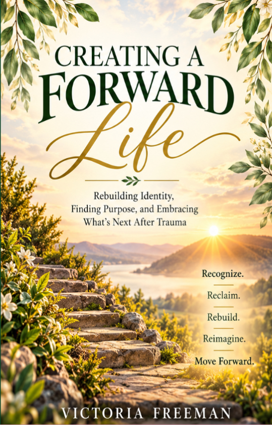 Book cover titled 'Creating a Forward Life' by Victoria Freeman, featuring a scenic landscape with steps leading to a lake and mountains at sunrise, surrounded by greenery.